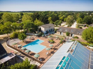 Indoor pool, seasonal outdoor pool, pool umbrellas, sun loungers