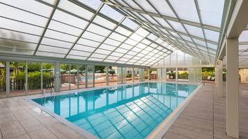 Indoor pool, seasonal outdoor pool, pool umbrellas, pool loungers