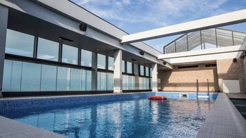 Indoor pool, seasonal outdoor pool, pool umbrellas, pool loungers