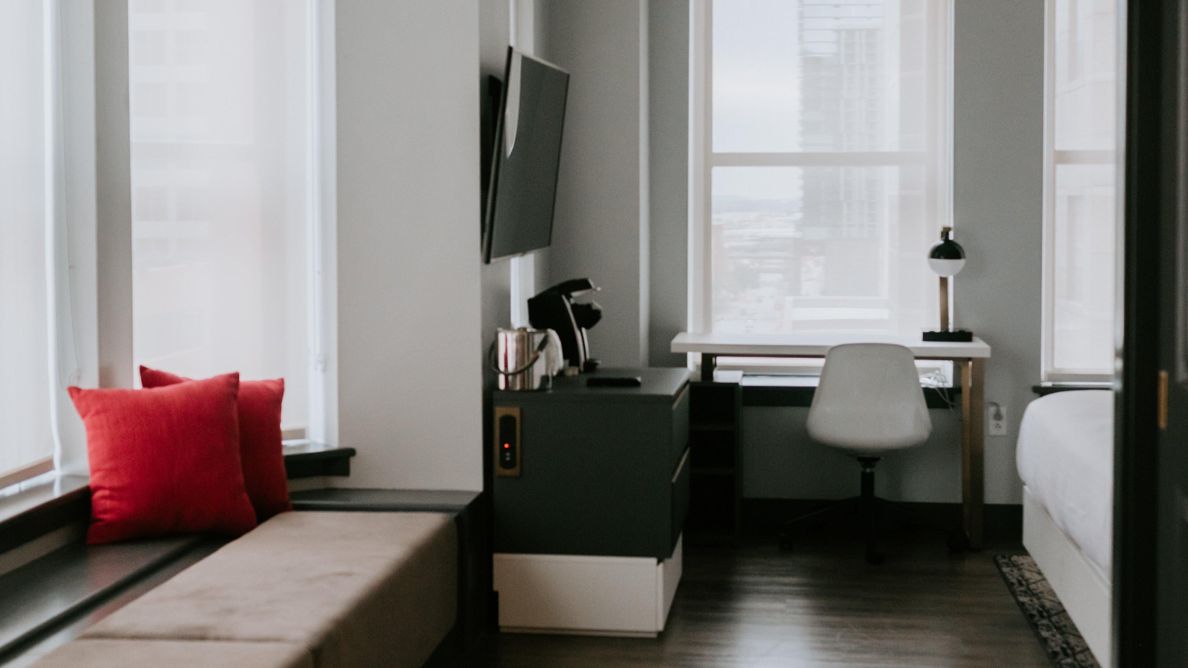 Premium bedding, pillow-top beds, desk, laptop workspace