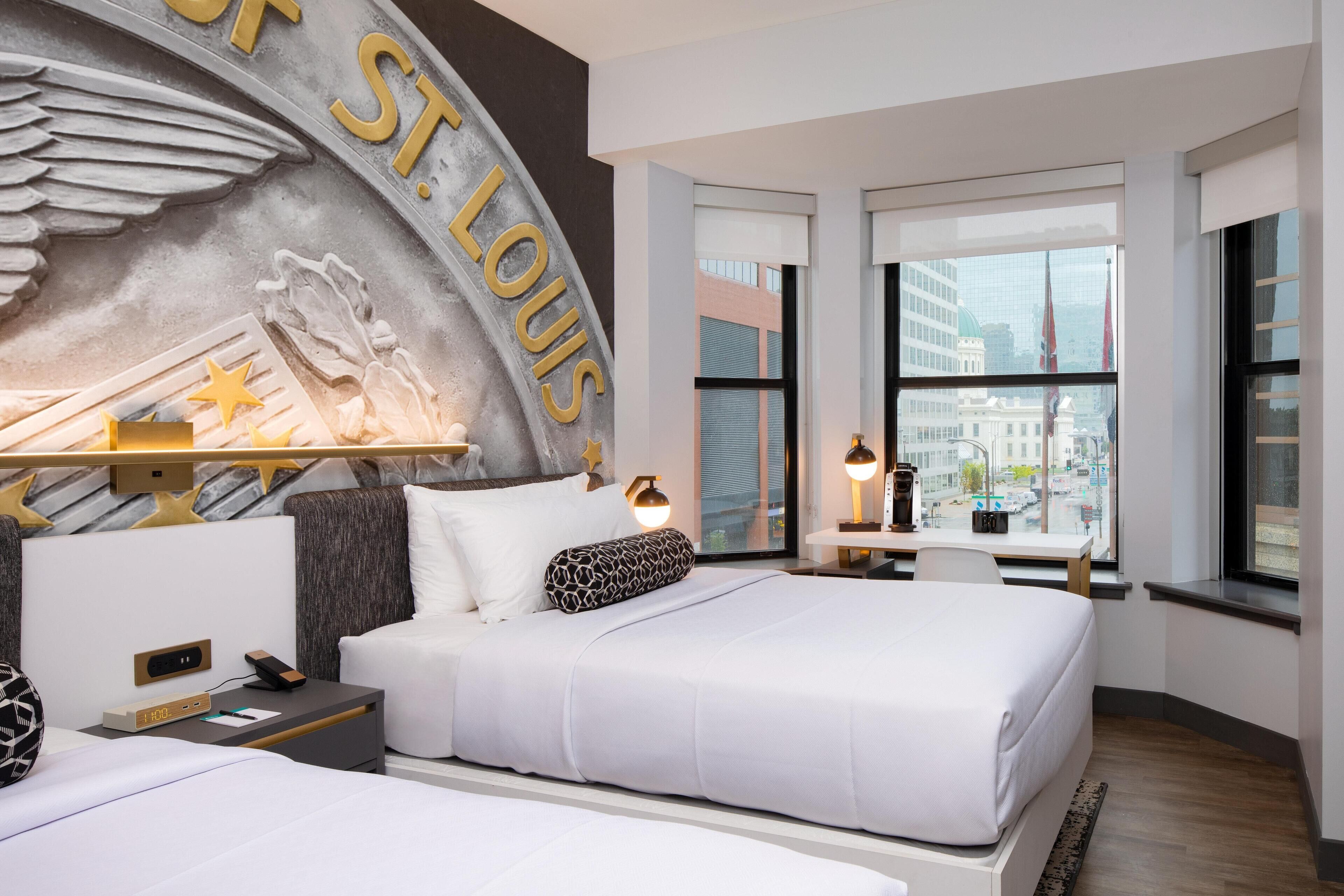 Premium bedding, pillow-top beds, desk, laptop workspace