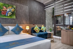 Habitación Deluxe | Ropa de cama de alta calidad, camas con pillow-top y minibar 