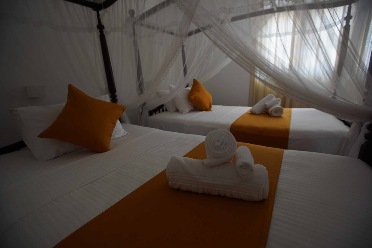 Family Room, 3 Twin Beds | Desk, iron/ironing board (on request), WiFi (free), bed sheets