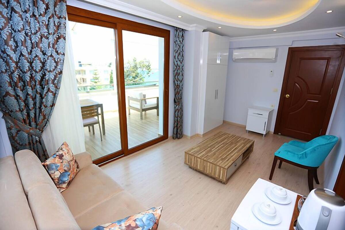 Deluxe Studio Suite, Sea View | Living area | LCD TV