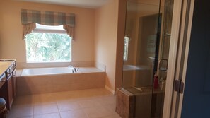 Bathtub, hair dryer, towels, soap