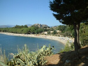 A coastal landscape with a beach, trees, and mountains in the background. - ideal location a stone's throw from the sea and a few minutes walk from the cent (Santa Maria Navarrese)