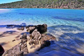 A beach with clear blue water and rocky formations. - Pambula Beach Seaview ~ stunning ocean views +12:00 pm check-out (Pambula Beach)