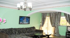 32-inch flat-screen TV with satellite channels, TV