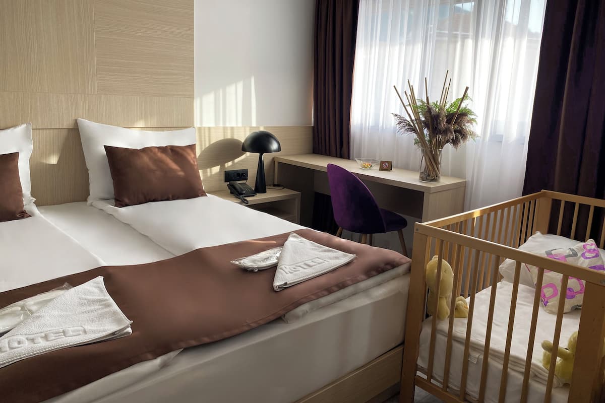 Deluxe Quadruple Room | Premium bedding, minibar, in-room safe, desk