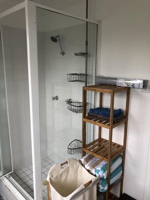 Shower, eco-friendly toiletries, towels, soap