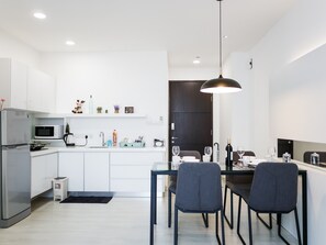 Fridge, coffee/tea maker, dining tables