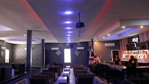 A bar area with seating and a bar counter. - KINGS PALACE HOTEL & LOUNGE (Ipaja)