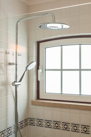 Bathtub, hair dryer, soap, shampoo