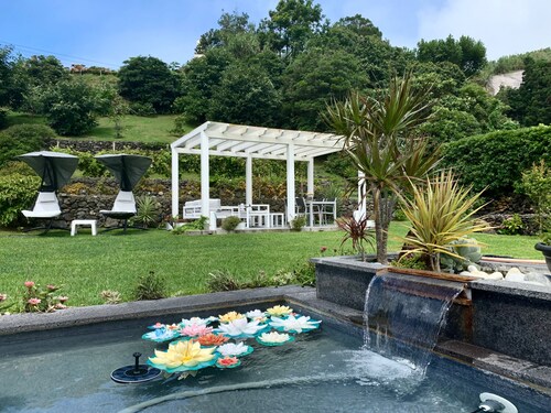 Modern house with indoor garden and large outside garden with barbecue to relax