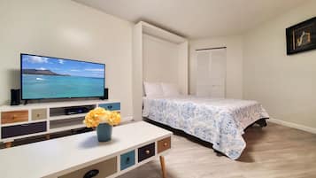 1 bedroom, desk, iron/ironing board, travel crib