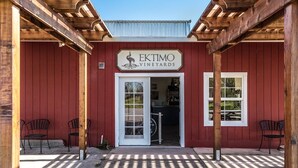 A red building with a sign reading "EKTIMO VINEYARDS". - Green Valley, Sonoma County Vacation Rental at a Working Winery. (Sebastopol)