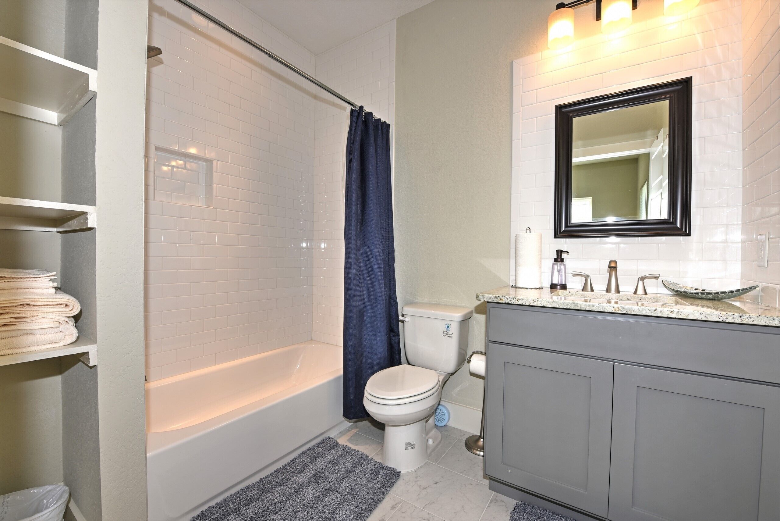 Combined shower/tub, hair dryer, towels, toilet paper