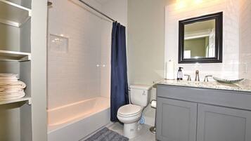 Combined shower/tub, hair dryer, towels, toilet paper