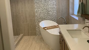 Combined shower/tub, hair dryer, towels, soap