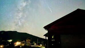 A building with the number 271, a street, and a starry night sky. - Peak View Retreats Family-friendly,  Rocky Mountain National Park Reg. 3230 (Estes Park)