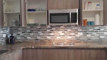 Fridge, microwave, stovetop, coffee/tea maker