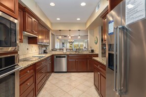 Fridge, dishwasher, coffee/tea maker, cookware/dishes/utensils