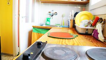 Fridge, electric kettle, cookware/dishes/utensils, paper towels