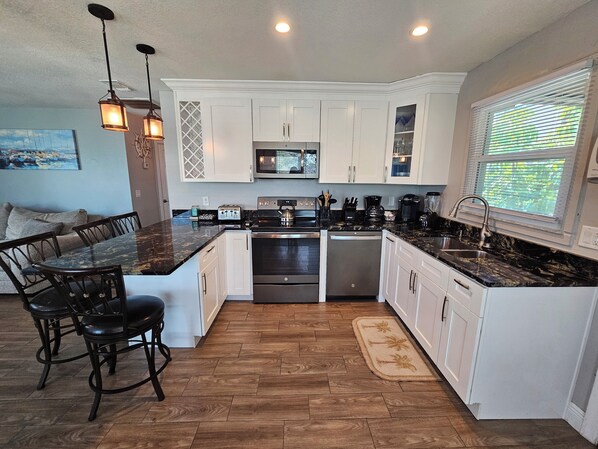 Fridge, microwave, oven, stovetop - El Palmar Cottages LLC House Third Row From The Beach (Indian Rocks Beach)