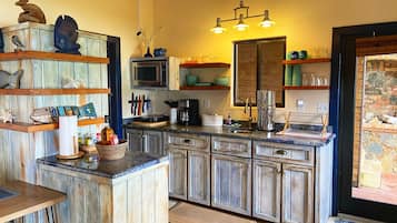 Fridge, microwave, stovetop, coffee/tea maker