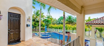 Elegant waterfront home with private pools, hot tub, & dock - walk to beach