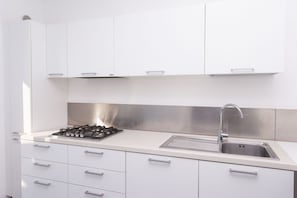 Fridge, oven, dishwasher, dining tables