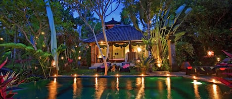 An infinity pool, pool loungers