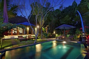 An infinity pool, sun loungers