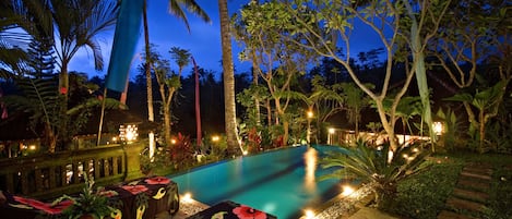 An infinity pool, sun loungers