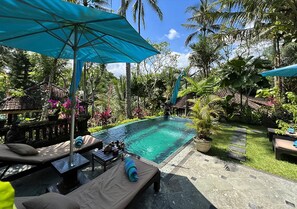 An infinity pool, sun loungers