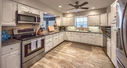 Newly remodeled stilted home with an apartment and game room! Great sunsets!