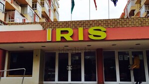 A building with a prominent 'IRIS' sign above the entrance. - Family studio 10 min walk from the beach (Benalmádena)