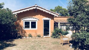 Relax in a serene, natural setting surrounded by lush vegetation and a peaceful outdoor space.