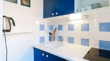 Fridge, microwave, cookware/dishes/utensils