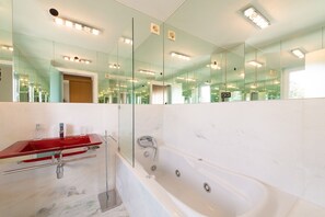 Bathtub, hair dryer, towels, soap