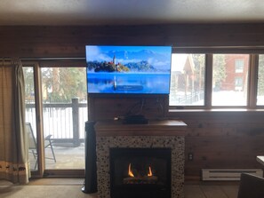 47 inch smart tv, gas fireplace, deck overlooking the pool and hot tubs. 