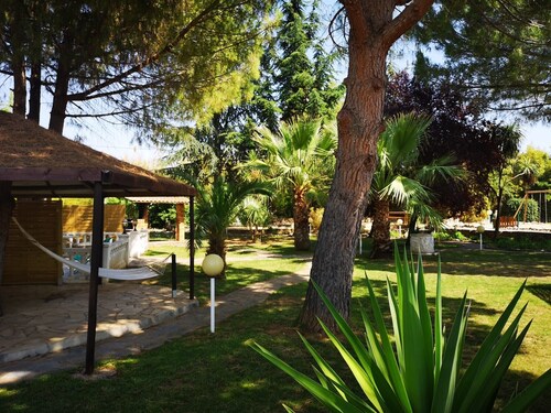 Gîte T3 Le Cycas with heated swimming pool in wooded grounds