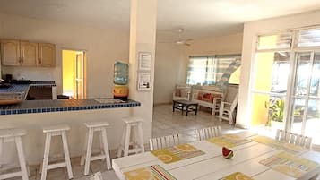 Fridge, stovetop, cookware/dishes/utensils, dining tables