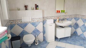 Bathtub, hair dryer, towels, soap