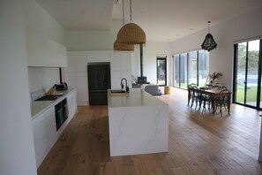 Enjoy cooking in this well-lit kitchen with ample workspace and a dining area.