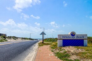 Access Whitecap Beach via a paved road, leading to a scenic beach area.