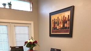 A dining area with a table set for four, surrounded by dark wooden chairs. - Your Retreat in Austin - Relax & enjoy free Netflix movies Pet Stays for Free ! (Austin)