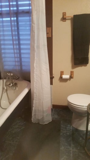Bathtub, hair dryer, towels, toilet paper - The Boho Suite at Hattie's Place, Too! (Galveston)