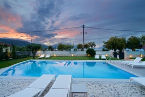 Seasonal outdoor pool, pool umbrellas, sun loungers