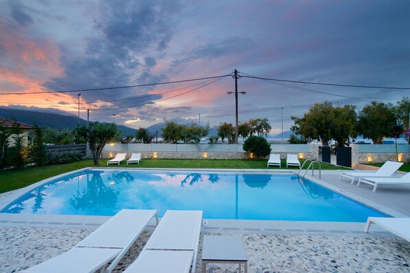 Seasonal outdoor pool, pool umbrellas, sun loungers